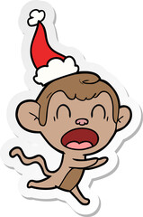 shouting sticker cartoon of a monkey wearing santa hat