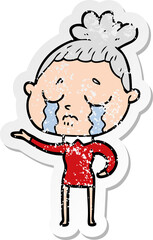 distressed sticker of a cartoon crying woman