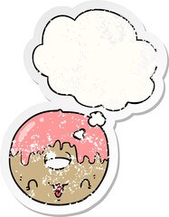 cute cartoon donut and thought bubble as a distressed worn sticker