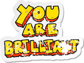 retro distressed sticker of a you are brilliant cartoon symbol