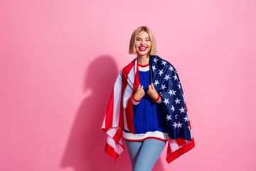 Portrait of young nice looking attractive lady cheerful wrapped posing with usa flag national...