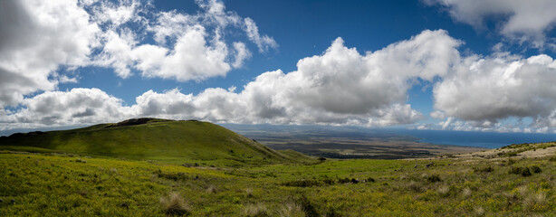 Panoramic view of a landscape of big island with big clouds
