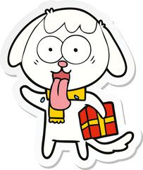 sticker of a cute cartoon dog with christmas present