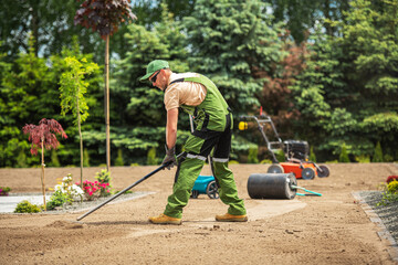 Professional Landscaper Replacing Residential Lawn