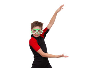 A little boy in a wetsuit and swimming goggles on a white background.