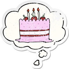 cartoon cake and thought bubble as a distressed worn sticker