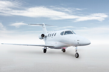 Modern white executive jet plane isolated on bright background with sky