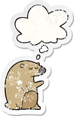 cartoon bear and thought bubble as a distressed worn sticker