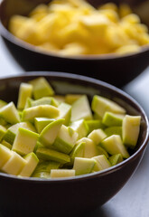 chopped zucchini in bowl close-up