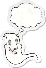 cartoon spooky ghost and thought bubble as a distressed worn sticker