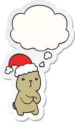 cartoon christmas bear worrying and thought bubble as a printed sticker