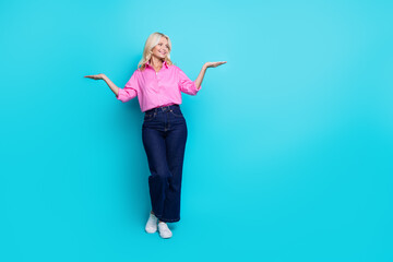 Fototapety  Full body photo of retired woman empty space scales dressed stylish pink smart casual clothes isolated on aquamarine color background