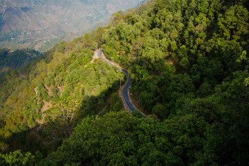 Beautiful  curvy Road on the mountains of Lansdowne, Uttarakhand. Aerial view of amazing curved road through the mountains.