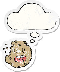 cartoon cookie and thought bubble as a distressed worn sticker