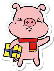 sticker of a cartoon angry pig with christmas present