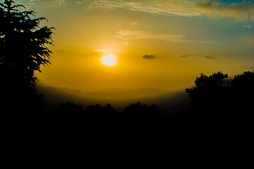 Sunset view from the mountains of Lansdowne. Mountain Sunset view in Lansdowne. Amazing  golden sunset seen through forest drive, Lansdowne Uttarakhand.