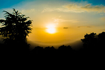 Sunset view from the mountains of Lansdowne. Mountain Sunset view in Lansdowne. Amazing  golden sunset seen through forest drive, Lansdowne Uttarakhand.