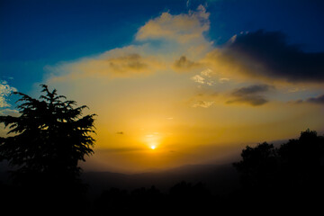 Sunset view from the mountains of Lansdowne. Mountain Sunset view in Lansdowne. Amazing  golden sunset seen through forest drive, Lansdowne Uttarakhand.