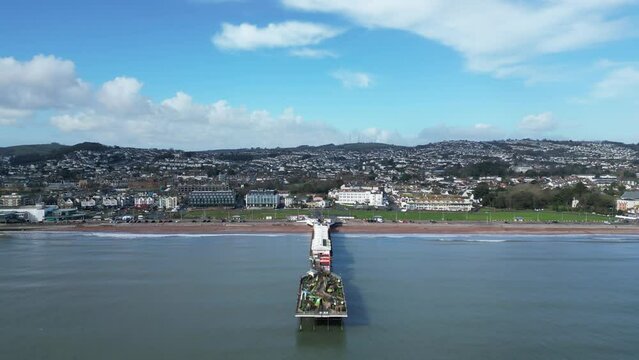 Paignton, Torbay, South Devon, England: DRONE VIEWS: The drone flies towards the major landmark and tourist attraction of Paignton Pier. Torbay is a popular English holiday resort (Clip 4).