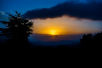 Sunset view from the mountains of Lansdowne. Mountain Sunset view in Lansdowne. Amazing  golden sunset seen through forest drive, Lansdowne Uttarakhand.