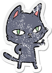 distressed sticker of a cartoon cat staring