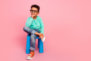 Full size photo of charming small boy sit chair minded face specs wear trendy aquamarine outfit...