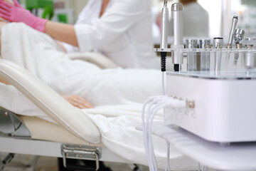 Cosmetic Clinic Treatment Room with Advanced Equipment. A serene treatment room in a cosmetic clinic with state-of-the-art skincare machinery, ready for patient procedures