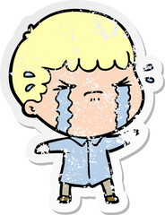 Obraz premium distressed sticker of a cartoon man crying