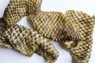 Crispy fish skin chips or skin fish crackers, Isolated on white background