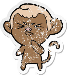 Obraz premium distressed sticker of a cartoon angry monkey