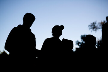 Silhouettes of four people