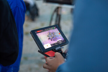 Drone pilot filming scene