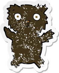 retro distressed sticker of a cartoon black bear