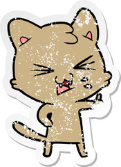 distressed sticker of a cartoon hissing cat