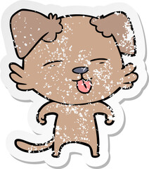 distressed sticker of a cartoon dog sticking out tongue