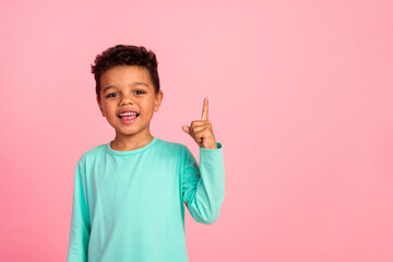 Photo portrait of cute little boy point up empty space dressed stylish cyan clothes isolated on...