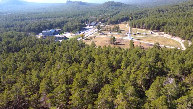 Aerial drone footage to the stunning nature of Borovoe, majestic cliffs with a pine forest, among which is the high stele of Ablai Khan. An atmospheric journey through Kazakhstan.