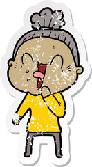 distressed sticker of a cartoon happy old woman
