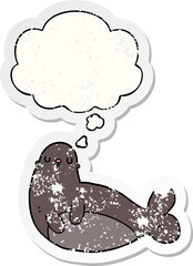 cartoon seal and thought bubble as a distressed worn sticker