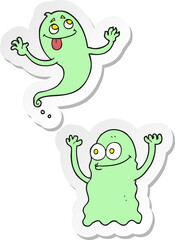 sticker of a cartoon ghosts