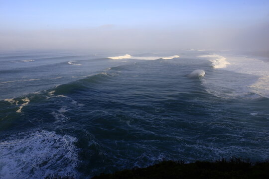 View on a wave on the Northern beach located in Nazaré in the Oeste region, in the historical province of Estremadura, Portugal