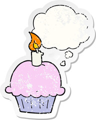 cartoon birthday cupcake and thought bubble as a distressed worn sticker