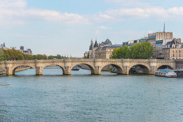 Naklejka premium Paris, France; 08.22.2018: Parisian bridge Pont Neuf on the Seine river on summer day