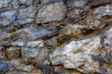 Old wall with wet stones