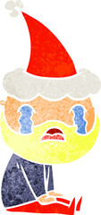 retro cartoon of a bearded man crying wearing santa hat
