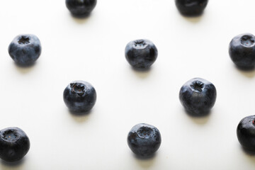 Blueberries patern over white background. Close up.