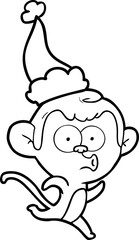 line drawing of a surprised monkey wearing santa hat