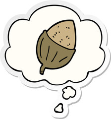 cartoon acorn and thought bubble as a printed sticker