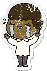 distressed sticker of a cartoon man crying