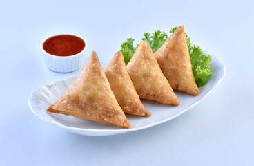 Samosa, a famous snack filled with spicy chicken and vegetables
